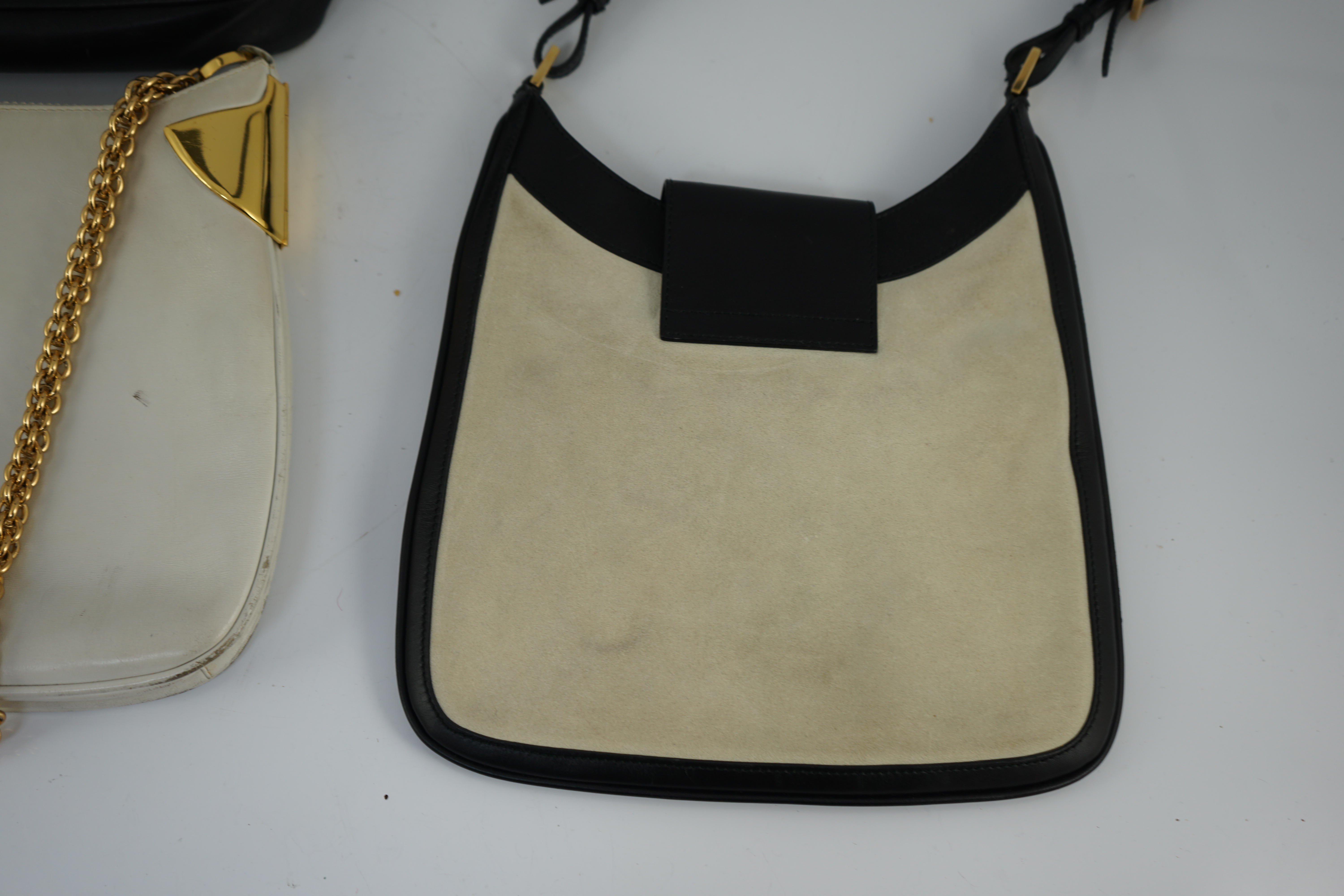 Three vintage Gucci hand bags and clutch wallet